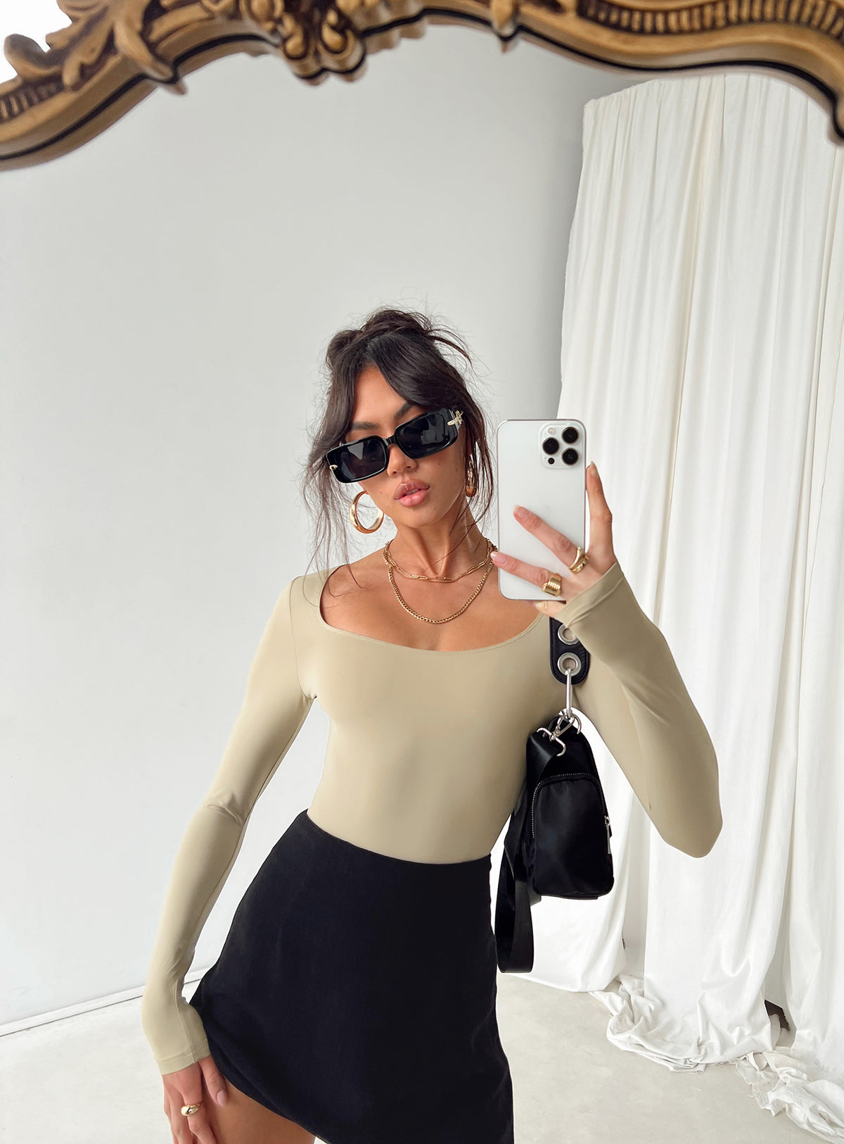 side view of model wearing Princess Polly Mallard Bodysuit Brown Petite Long Sleeve Tops Bodysuit 