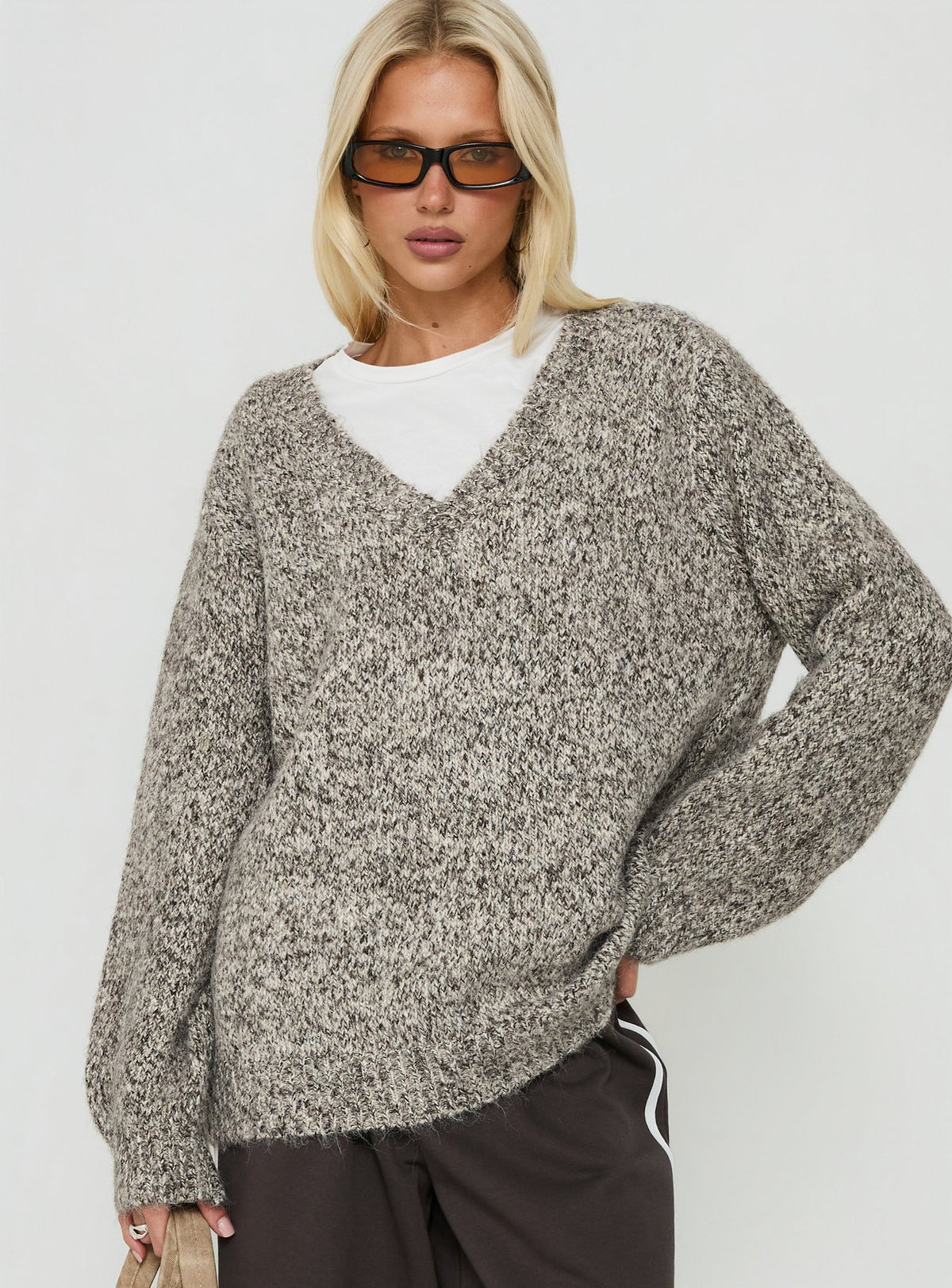 Showcasing the Ladiya V Neck Knit Sweater Brown Speckle womens-jumpers in long oversized fit front view of model wearing Princess Polly