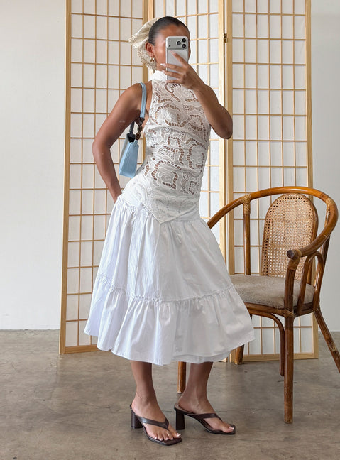 Showcasing the Cascades Low Rise Midi Skirt White womens-skirts in midi length front view of model wearing