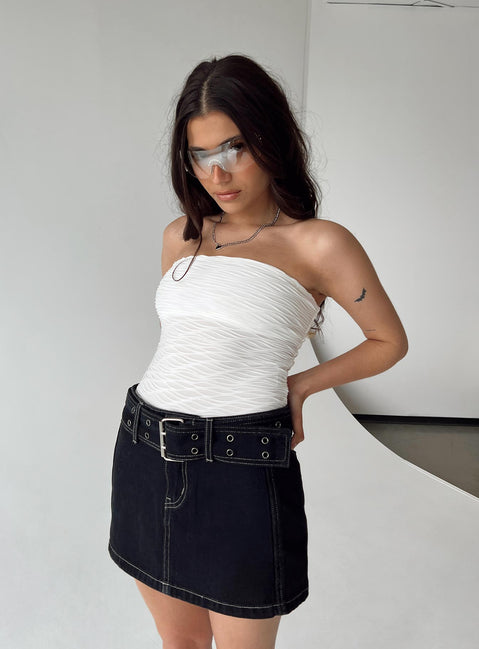 side view of model wearing Princess Polly Makena Strapless Bodysuit White Petite Sleeveless Bodysuit 