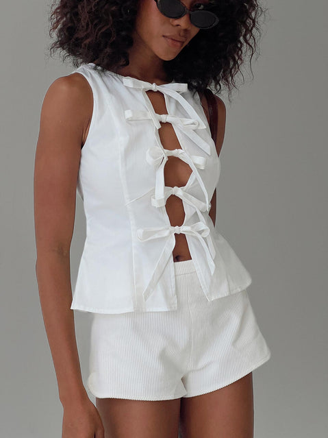 side view of model wearing Princess Polly Luminary Tie Up Top White Sleeveless Crew Neck 