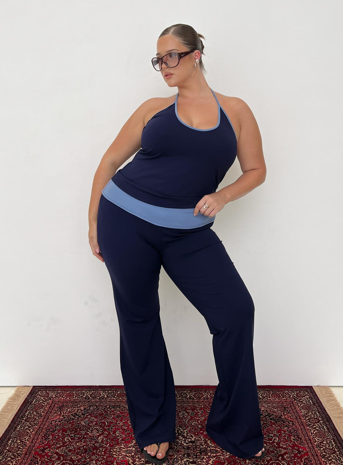 front view of model wearing Princess Polly Kobee Jersey Flare Pants Navy / Light Blue Curve High Rise Pants Pants 