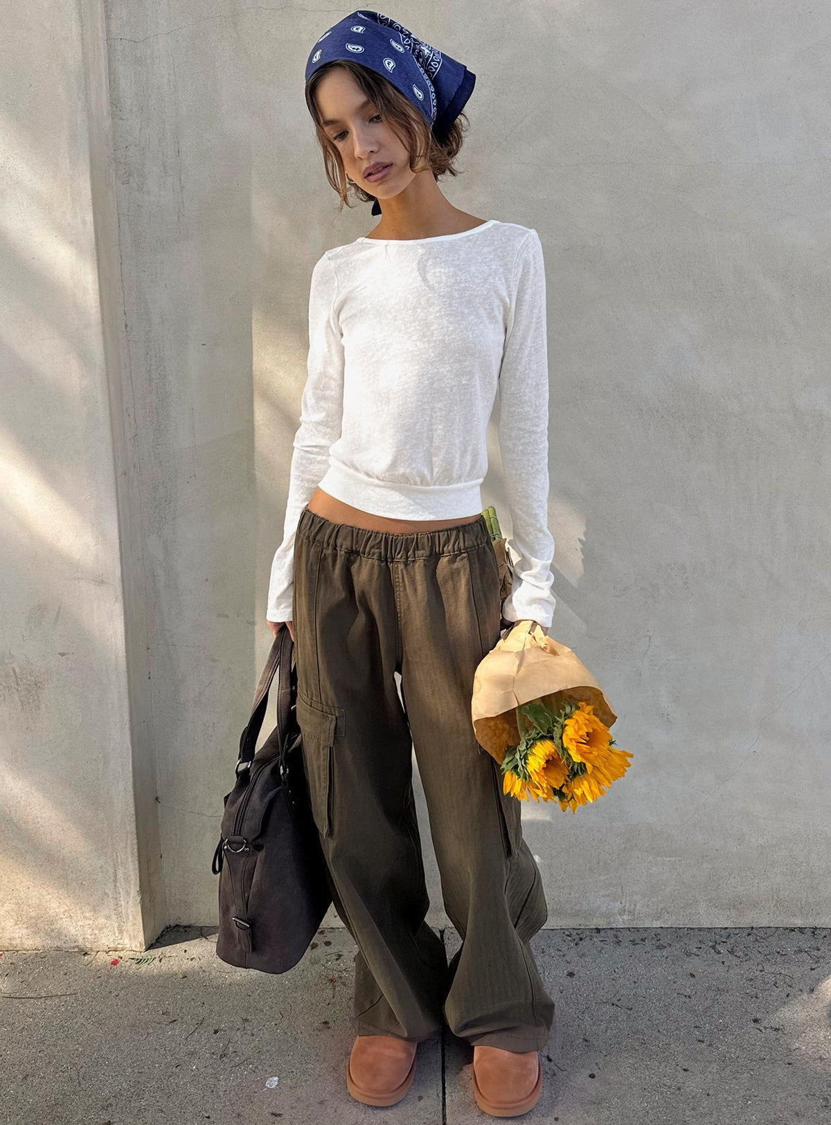 Showcasing the Scarletta Ultra Wide Elasticated Waist Cargo Pants Khaki in womens regular pants with high-rise front view of model wearing Princess Polly