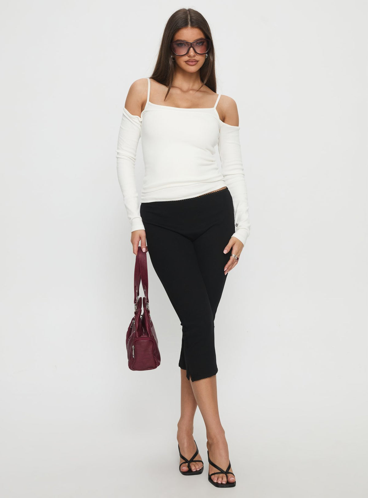 front view of model wearing Princess Polly Baseline Rib Capri Pants Black Tall Mid Rise Pants Pants 