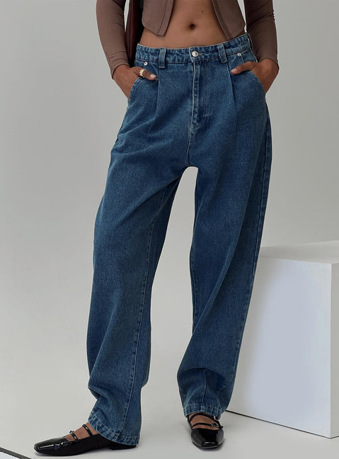 front view of model wearing Princess Polly Forestier Mid Rise Barrel Leg Pin Tuck Jeans Mid Blue High Rise Jeans Jeans 