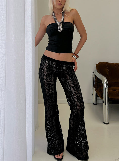 Featuring Rosadonna Lace Flare Pants Black in womens regular pants with mid-rise front view of model wearing Princess Polly