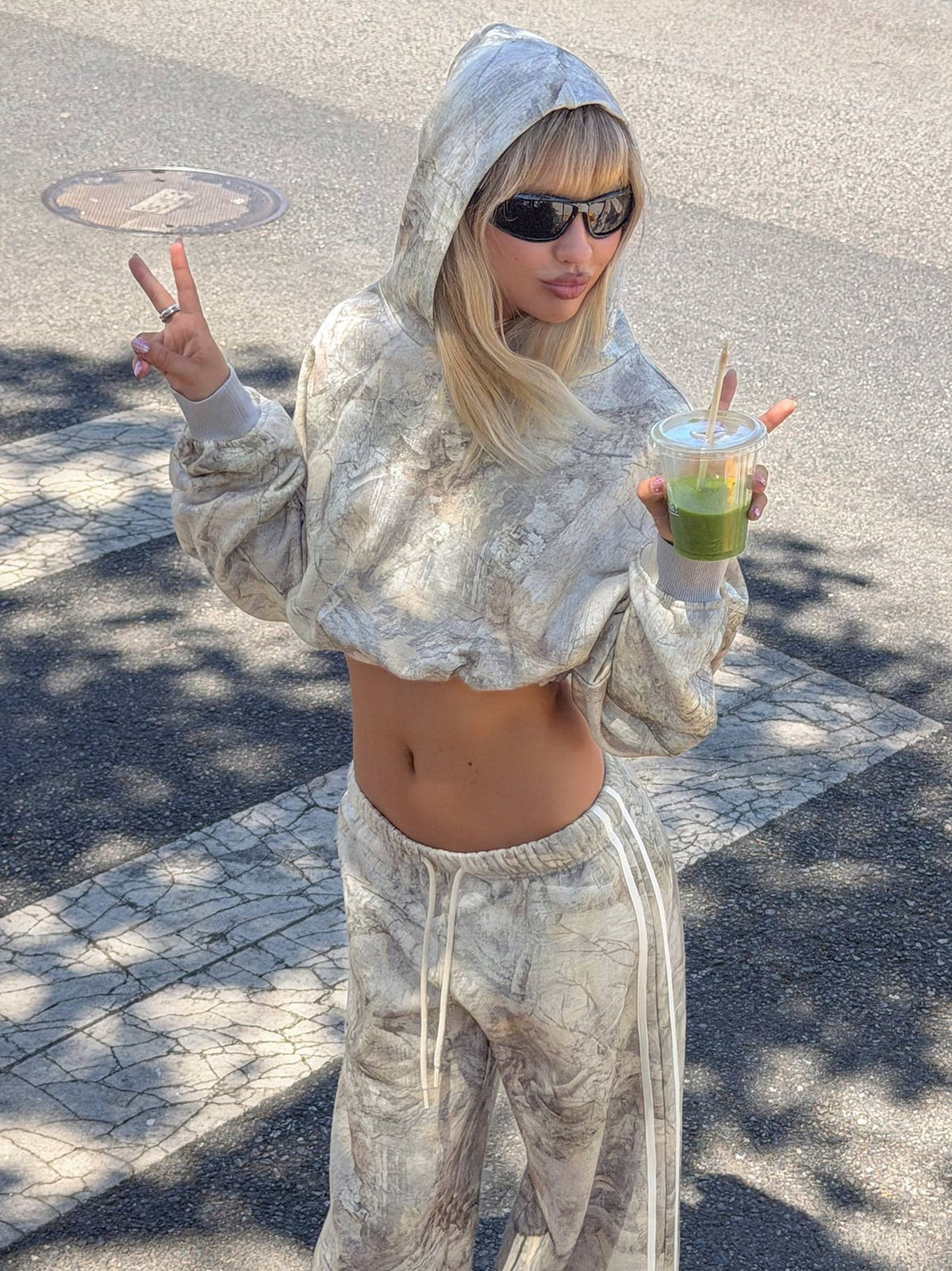 Showcasing the Mayse Bubble Hem Cropped Hoodie Camo womens-jumpers in short length with camo print featuring hood and oversized fit product Princess Polly