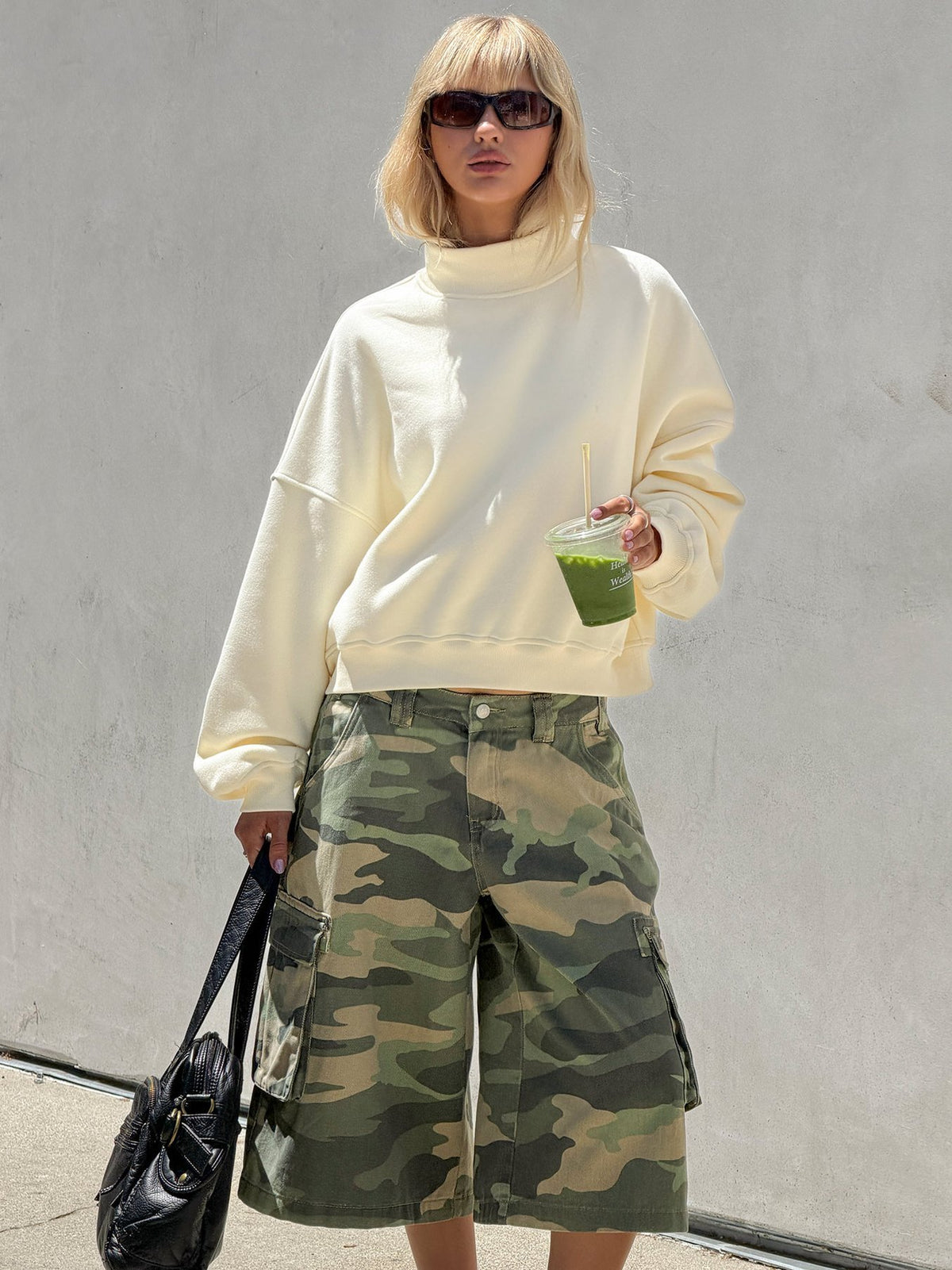 Showcasing the Anyya Funnel Neck Crew Jumper Cream in a short womens jumper front view of model wearing Princess Polly