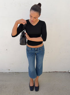 Showcasing the Hierarchy Low Rise 3/4 Length Jeans Mid Wash in womens-jeans front view of model wearing Princess Polly