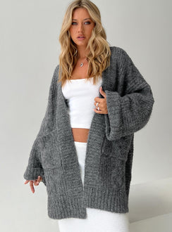 Showcasing the Paisleigh Cable Knit Cardigan Charcoal womens jumpers in long length front view of model wearing Princess Polly