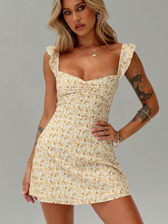 side view of model wearing Princess Polly Landon Mini Dress Yellow Floral Petite Scoop Neck 