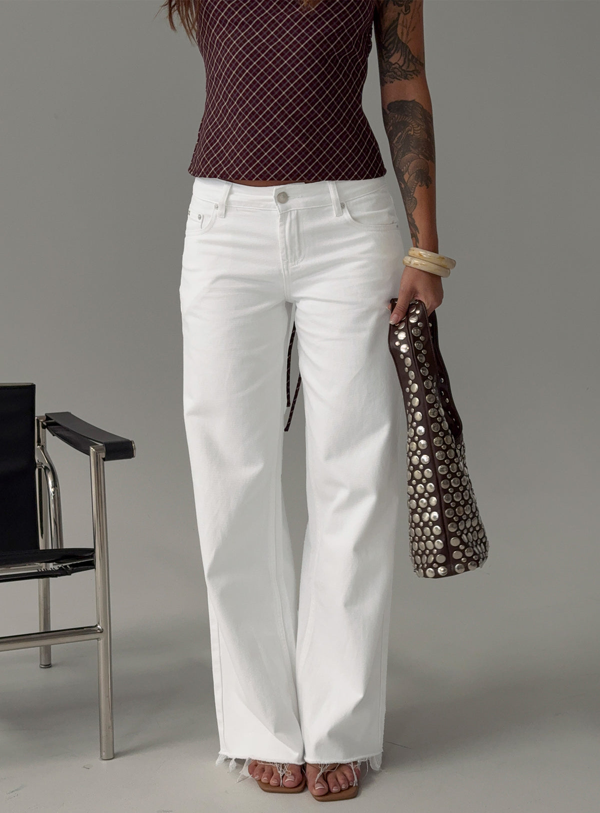 side view of model wearing Princess Polly Sabryna Low Rise Straight Leg Jeans White Low Rise Jeans Jeans 