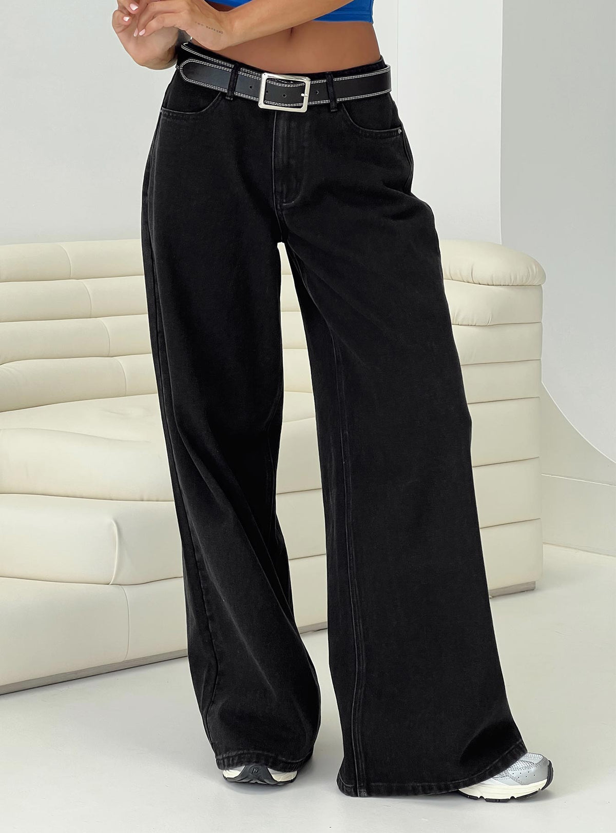 side view of model wearing Princess Polly Naylor Wide Leg Jeans Washed Black Denim Petite High Waisted 