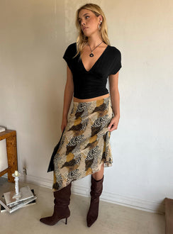 Featuring the Suella Asymmetrical Midi Skirt Animal Multi in womens skirts with relaxed fit, wrap design, and leopard print side view of model wearing Princess Polly