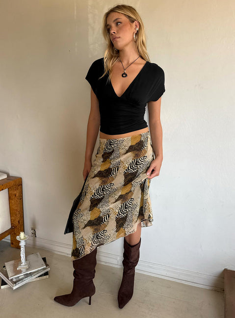 Featuring the Suella Asymmetrical Midi Skirt Animal Multi in womens skirts with relaxed fit, wrap design, and leopard print side view of model wearing Princess Polly
