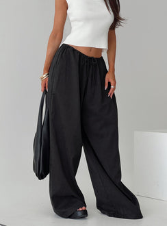 Designed with Bungala Oversized Relaxed Pants Black Tall wide-leg womens regular pants in mid-rise side view of model wearing Princess Polly
