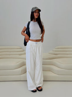 side view of model wearing Princess Polly Beach House Pants White High Rise Pants Pants 