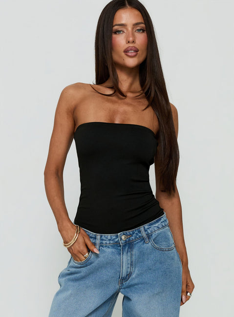 Showcasing the Namari Strapless Bodysuit Black womens-bodysuit with sleeveless and ruched details front view of model wearing Princess Polly
