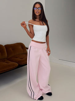 Showcasing Lockie Foldover Baggy Track Pants Pink / Black in womens regular pants with high-rise waist side view of model wearing Princess Polly