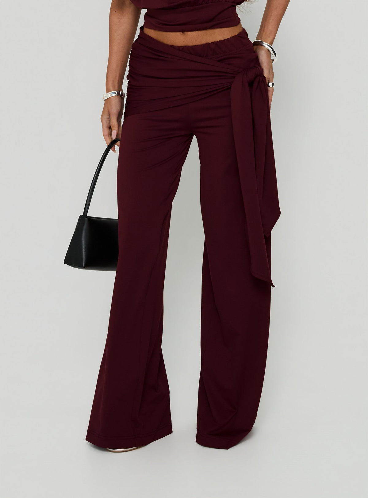 Showcasing Hadlia Tie Waist Pants Burgundy Petite womens-regular-pants with high-rise front view of model wearing