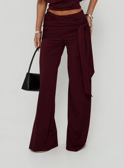Showcasing Hadlia Tie Waist Pants Burgundy Petite womens-regular-pants with high-rise front view of model wearing