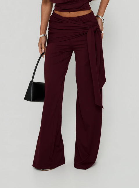 Showcasing the Hadlia Tie Waist Pants Burgundy Tall womens-regular-pants with high-rise detail front view of model wearing