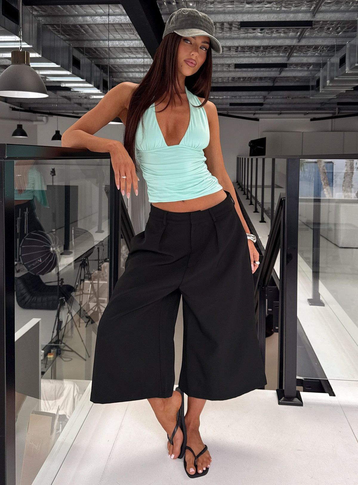 Showcasing the Busy Busy Low Baggy Capri Pant Black in womens-regular-pants with low-rise front view of model wearing Princess Polly