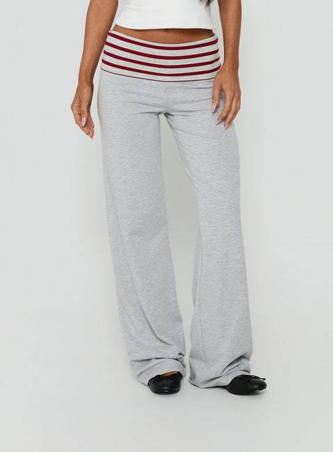 Showcasing Jetset Pants Grey Red Stripe in womens regular pants with mid-rise striped wide-leg styling front view of model wearing Princess Polly