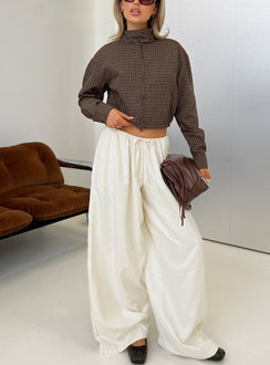Introducing the Bungala Oversized Relaxed Pants in Ivory Petite womens-regular-pants featuring high-rise waist and wide-leg silhouette front view of model wearing Princess Polly