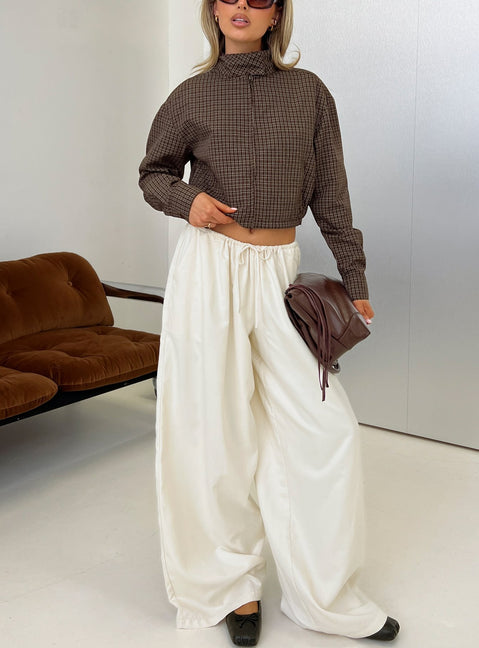 Introducing the Bungala Oversized Relaxed Pants in Ivory Petite womens-regular-pants featuring high-rise waist and wide-leg silhouette front view of model wearing Princess Polly