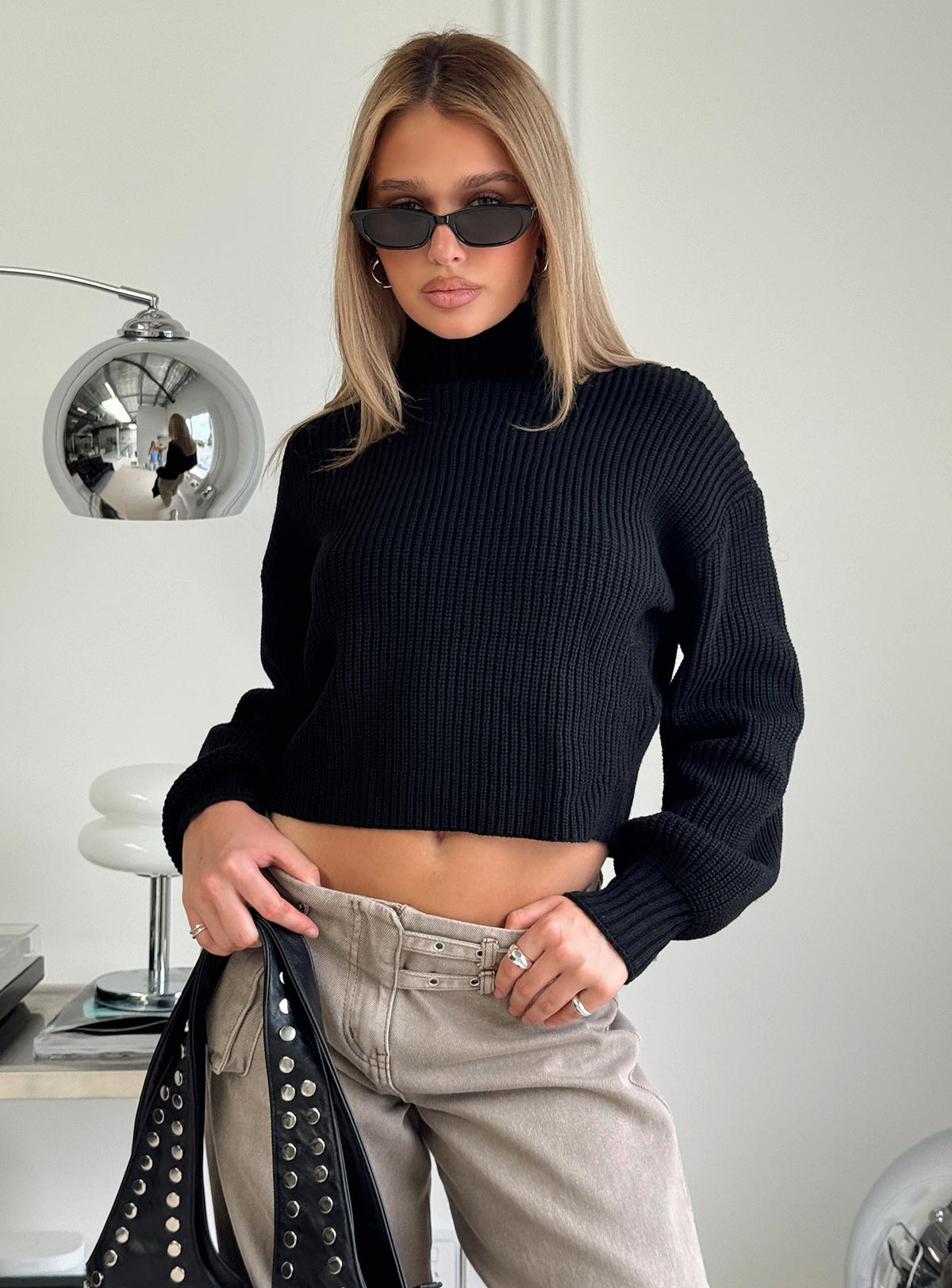 side view of model wearing Princess Polly Sayge Mock Neck Knit Sweater Black cropped Jumpers 