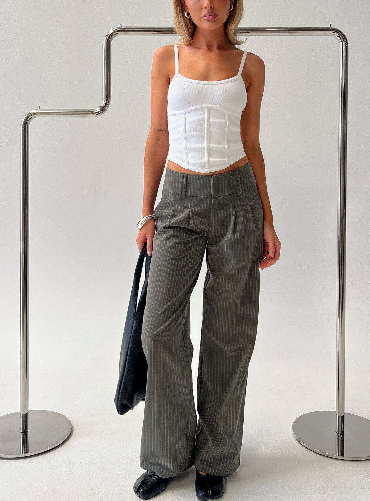 Experience the Two Lovers Low Rise Pants Grey Pinstripe in womens-regular-pants front view of model wearing Princess Polly