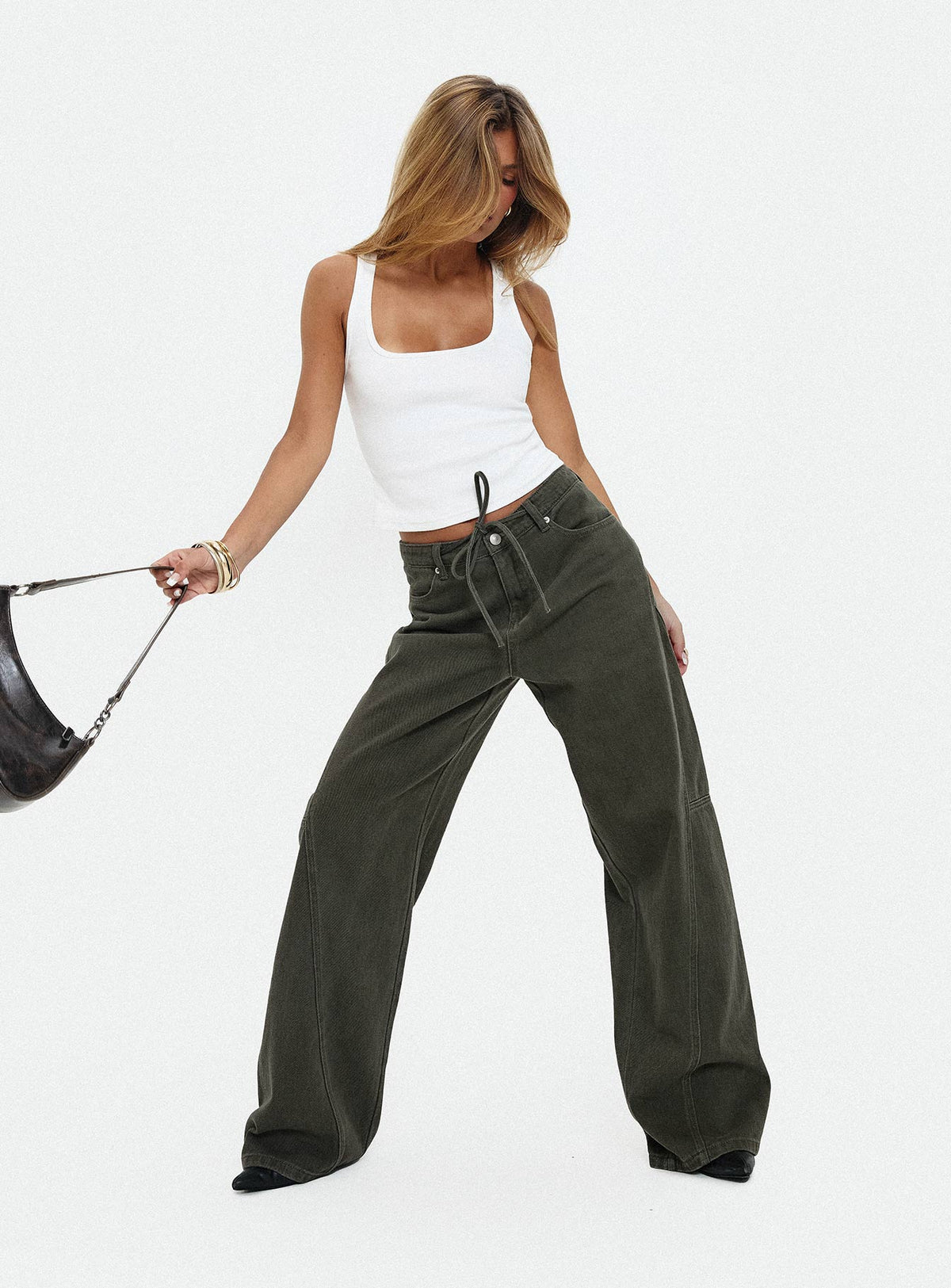 back view of model wearing Princess Polly Bruiser Tie Waist Mid Rise Wide Leg Jeans Green High Rise Jeans Jeans 