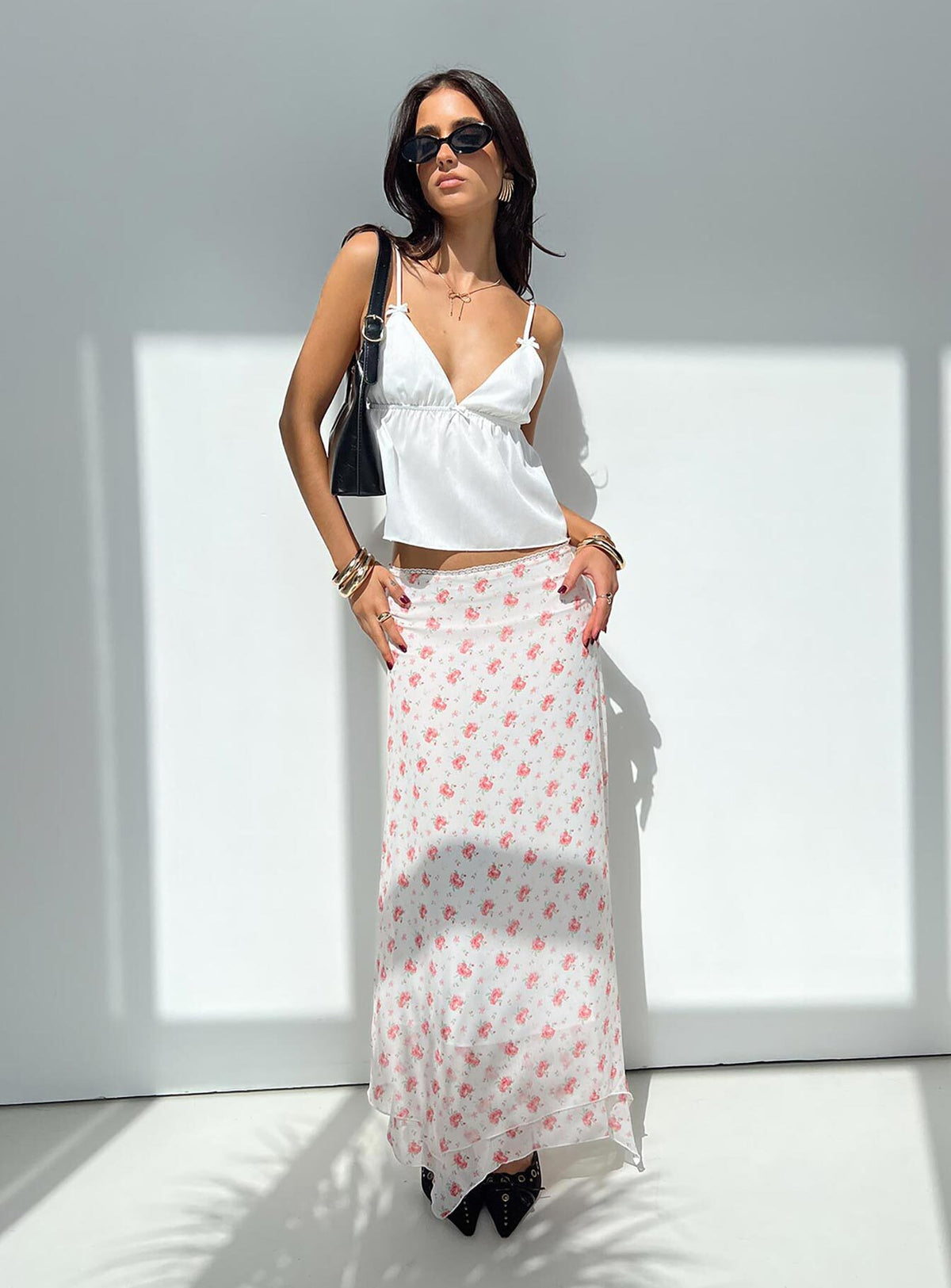   side view of model wearing Princess Polly Dancing In A Field Maxi Skirt Pink Floral Maxi Skirts Skirts 