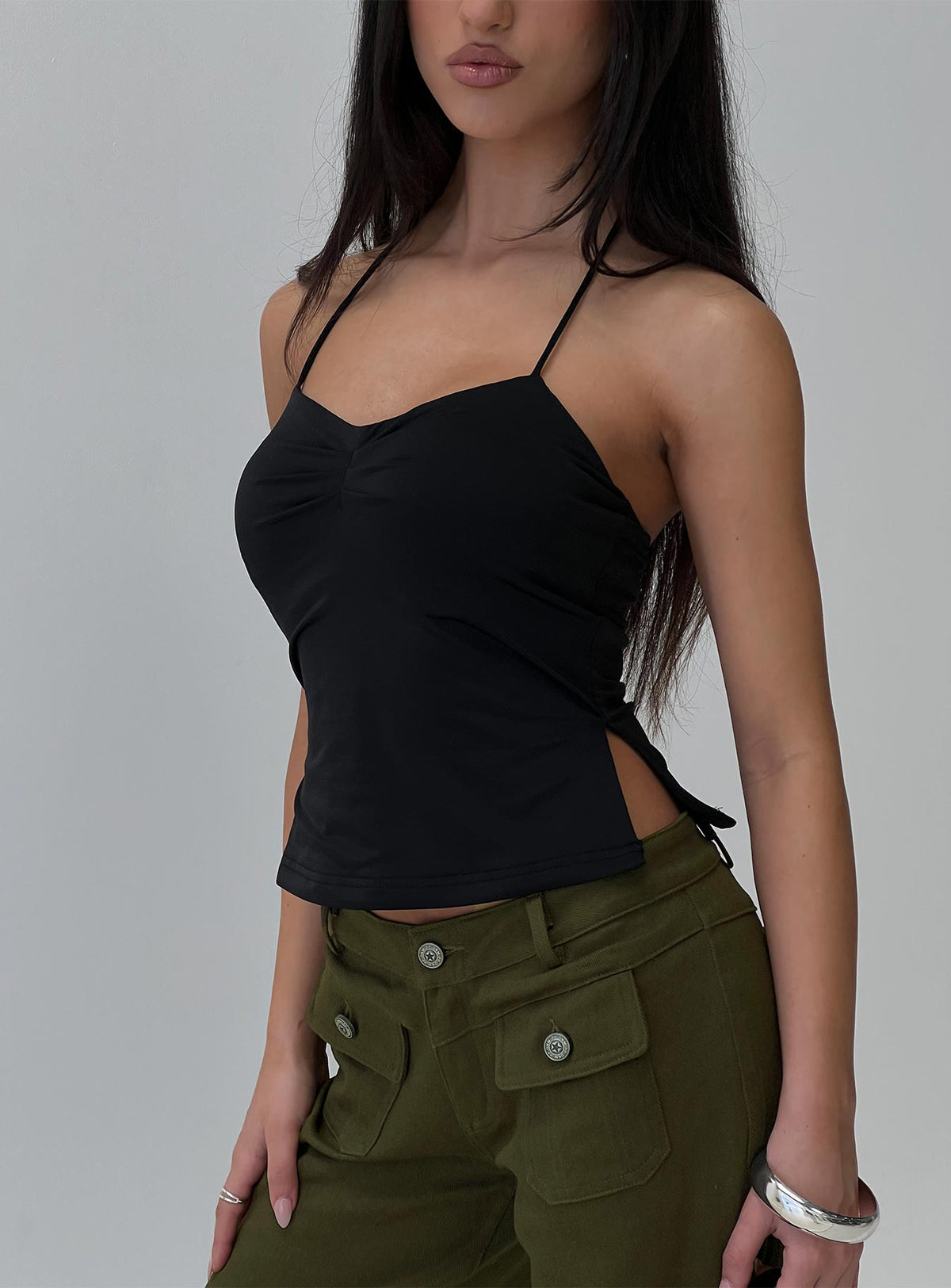 side view of model wearing Princess Polly Rehna Halter Top Black Sleeveless Sweetheart 