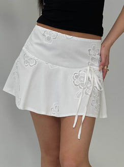   side view of model wearing Princess Polly Drisana Tie Detail Embroidered Mini Skirt White Mini Skirts Skirts 