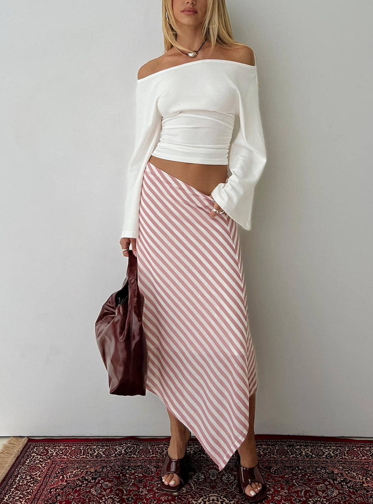   front view of model wearing Princess Polly Gwenora Asymmetrical Midi Skirt Pink Stripe Midi Skirts Skirts 