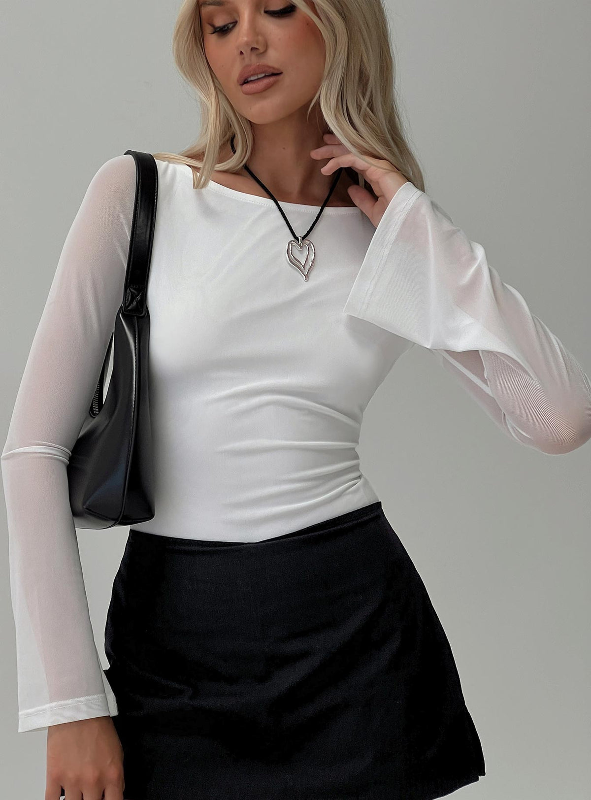 front view of model wearing Princess Polly Lukea Long Sleeve Bodysuit White Long Sleeve Tops Bodysuit 