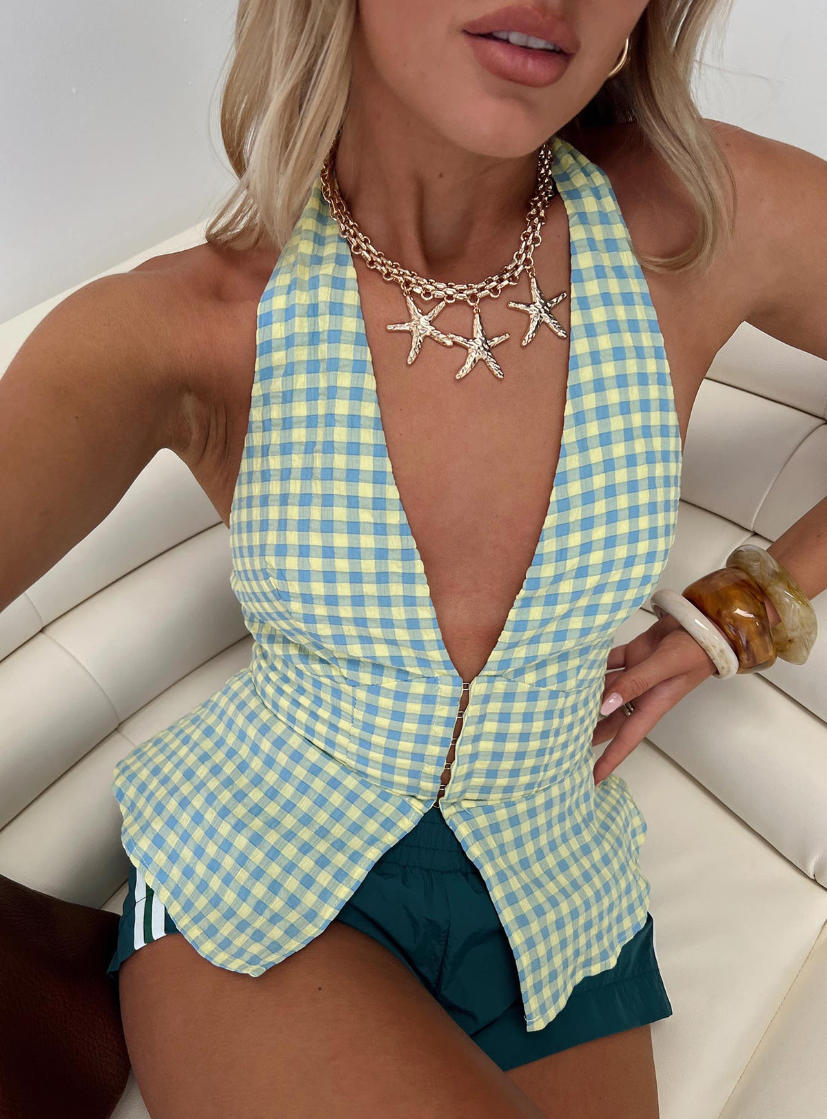 side view of model wearing Princess Polly Becci Halter Top Multi Sleeveless Plunger 