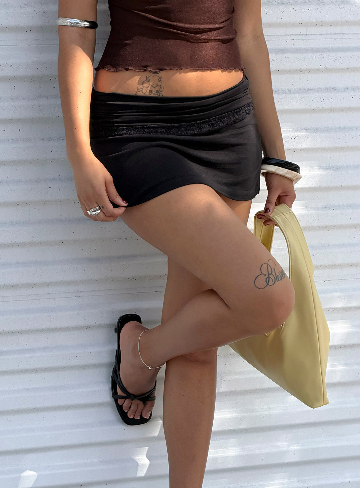 back view of model wearing Princess Polly Amia Lace Mini Skirt Black Mini Skirts Skirts 