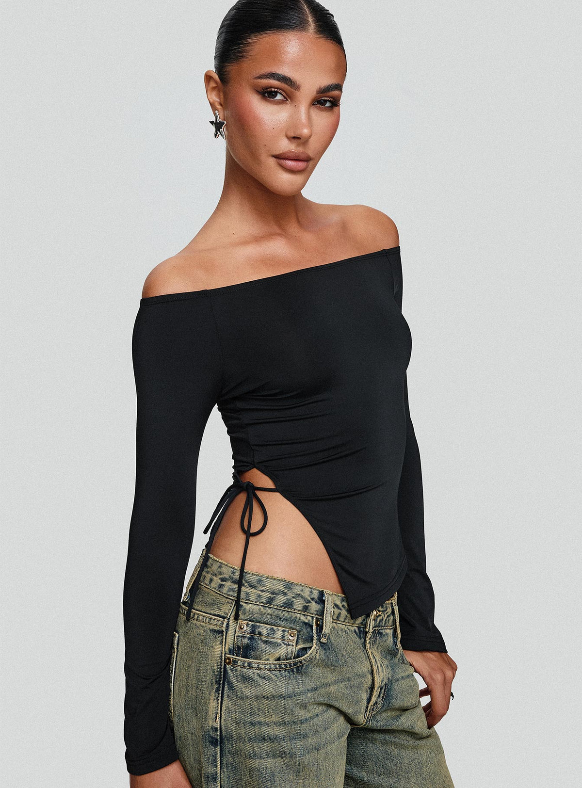 side view of model wearing Princess Polly Endellion Off Shoulder Long Sleeve Top Black Full Sleeves straight 