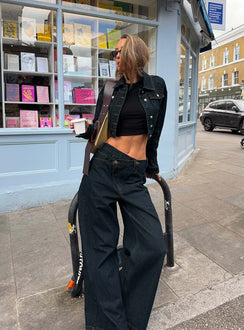 back view of model wearing Princess Polly Blue Crush Low Rise Wide Leg Jeans Indigo Mid Rise Jeans Jeans 
