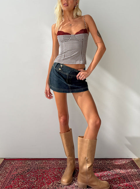 Showcasing the Ladena Mid Rise Double Button Mini Skirt Raw Denim womens-skirts  front view of model wearing Princess Polly
