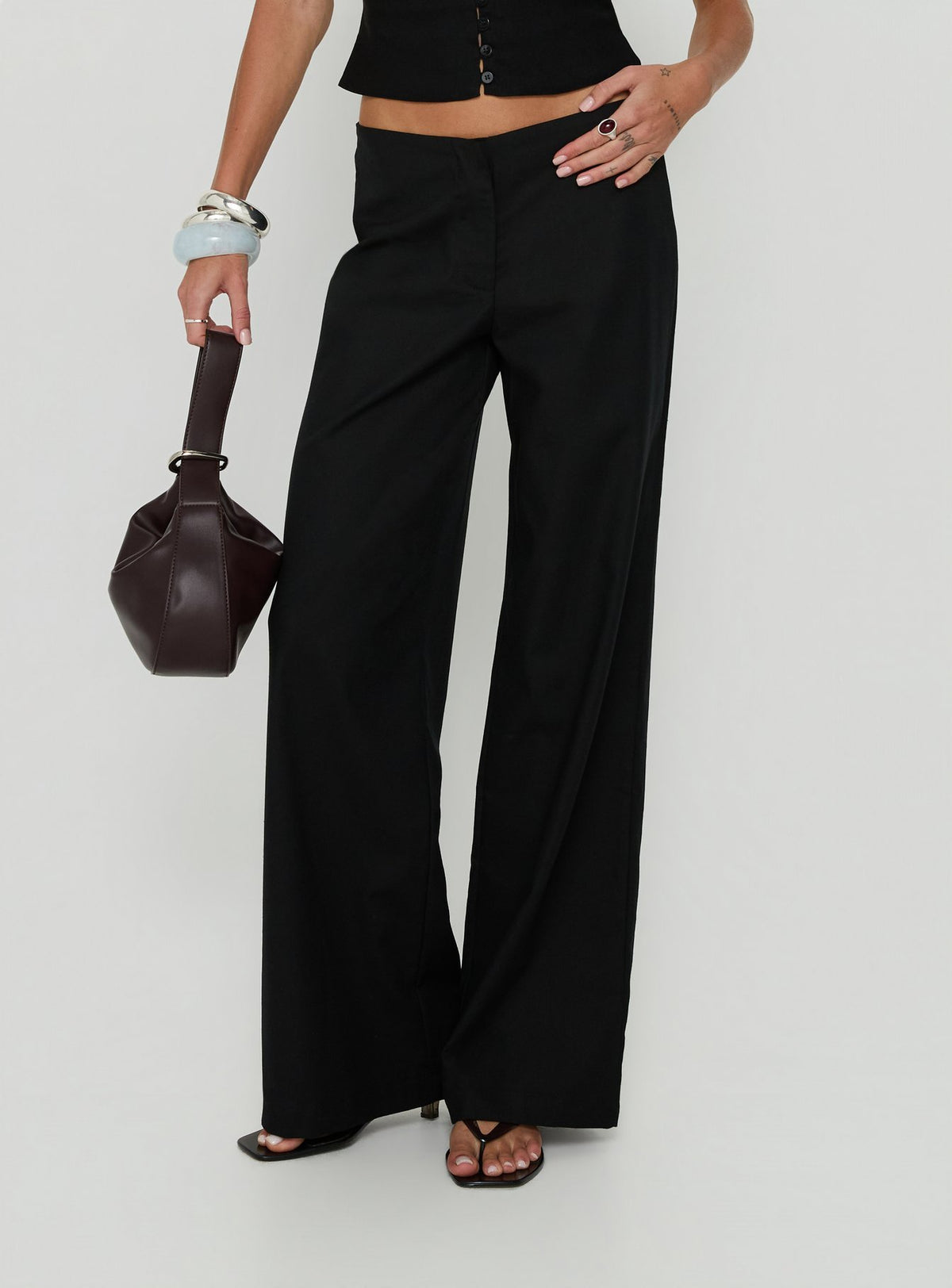 Featuring Agazia No Waist Low Rise Straight Pants Black in womens regular pants detail view of model wearing
