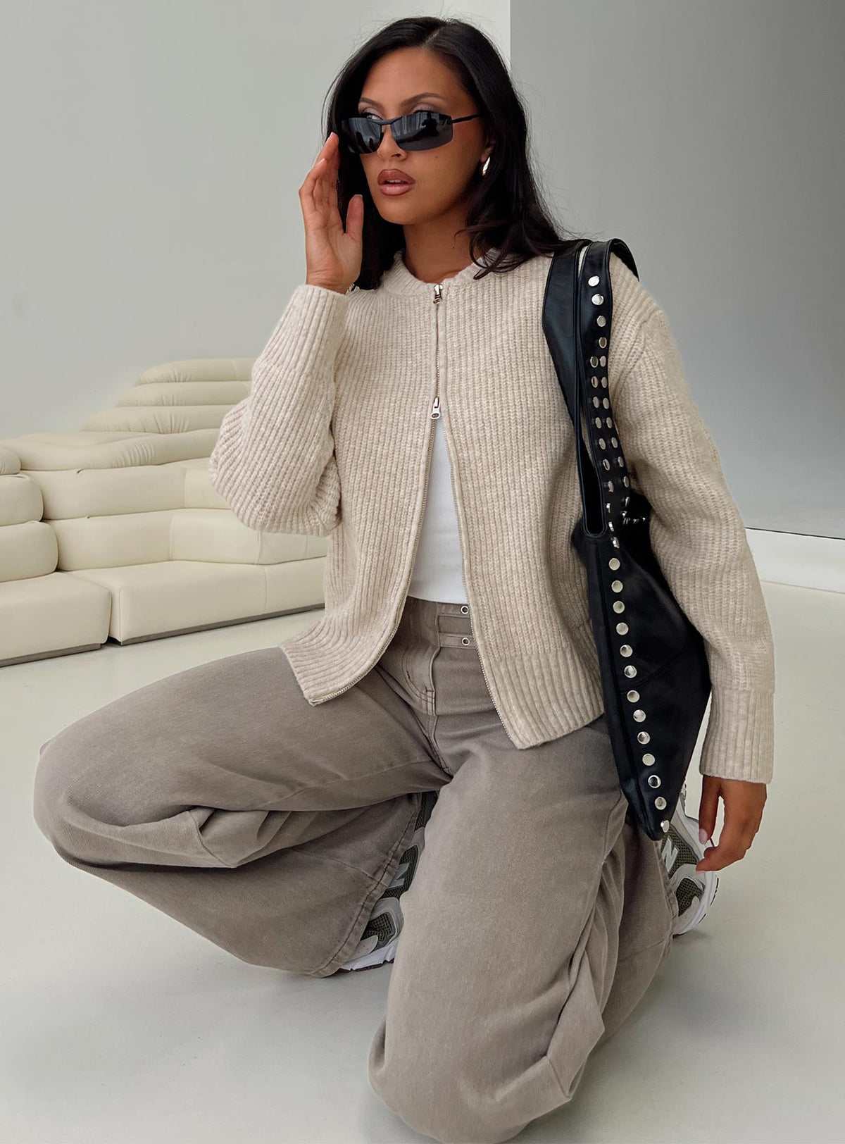 side view of model wearing Princess Polly Lexene Zip Through Jumper Oat Cropped Jumpers Jumpers 