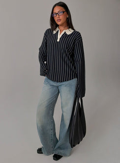 Showcasing the Boarders V Neck Polo Jumper Navy Stripe womens-jumpers in short length with oversized fit side view of model wearing Princess Polly