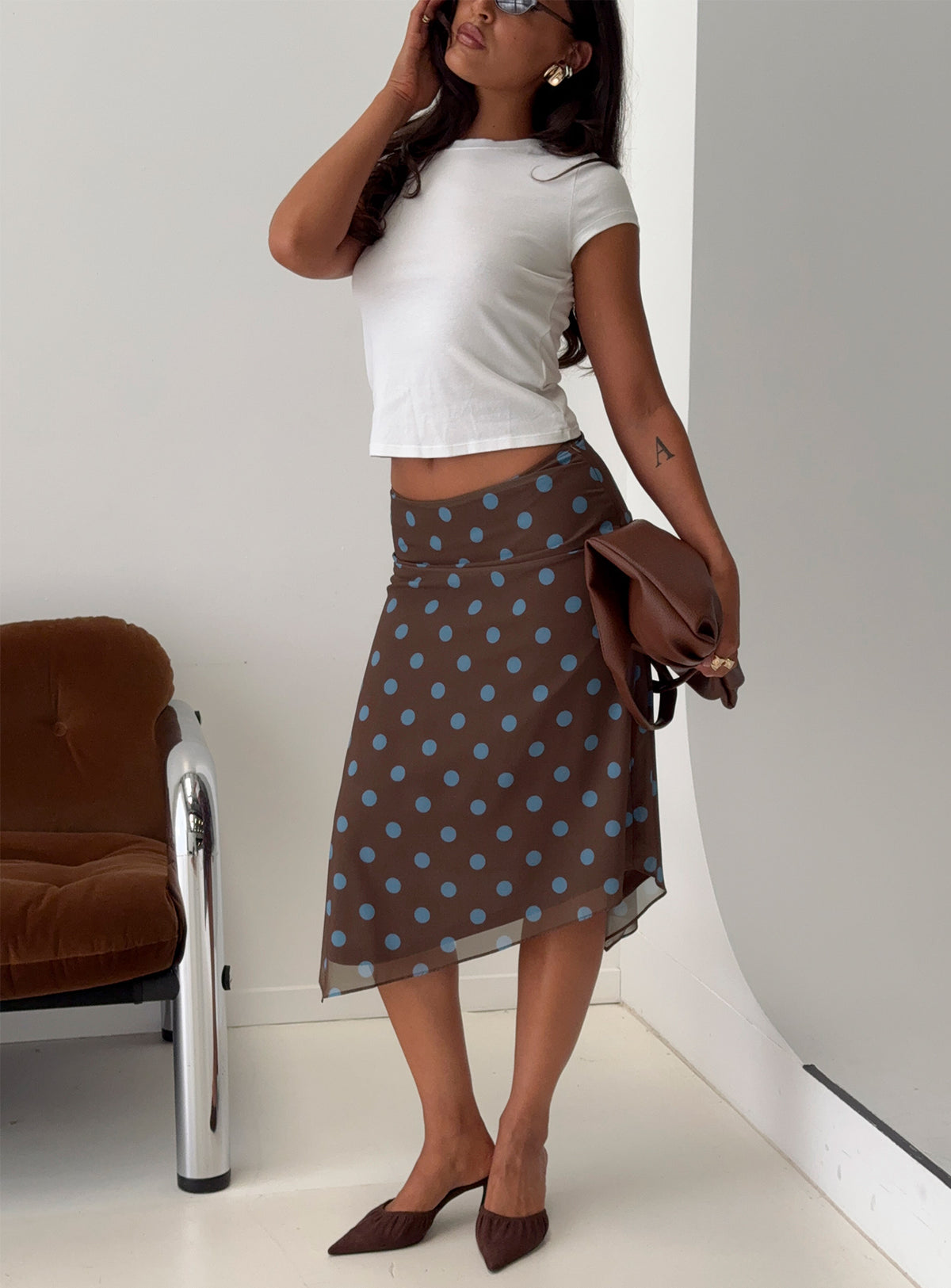   side view of model wearing Princess Polly Daphene Asymmetrical Midi Skirt Brown / Blue Polka Dot Midi Skirts Skirts 