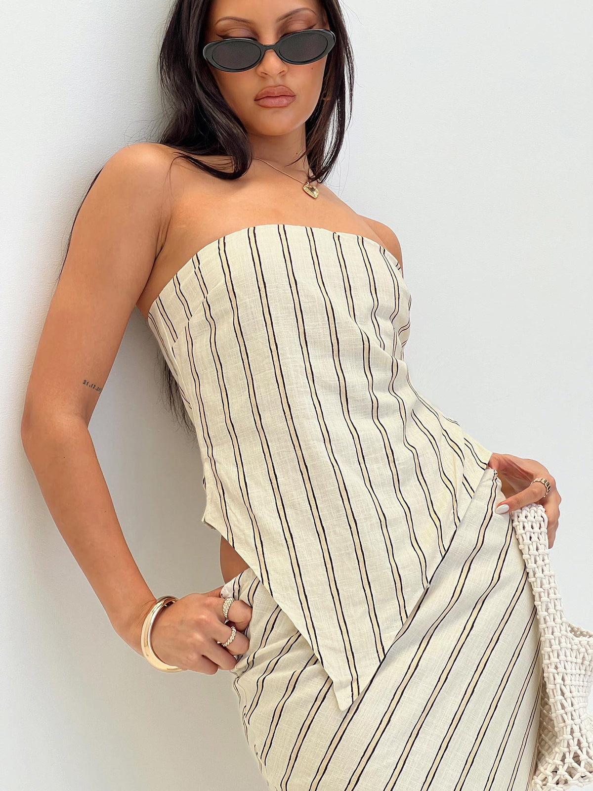 front view of model wearing Princess Polly Birdie Asymmetric Linen Blend Top Cream Sleeveless straight 