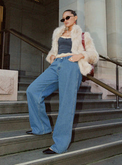 side view of model wearing Princess Polly Maryanne Mid Rise Relaxed Jeans Mid Wash Denim Tall Mid Rise Jeans Jeans 