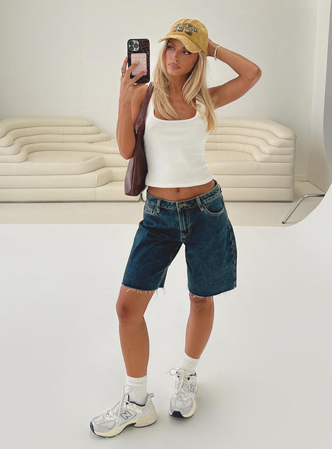 back view of model wearing Princess Polly Cult Classic Longline Denim Shorts Vintage Wash Low Rise Shorts 